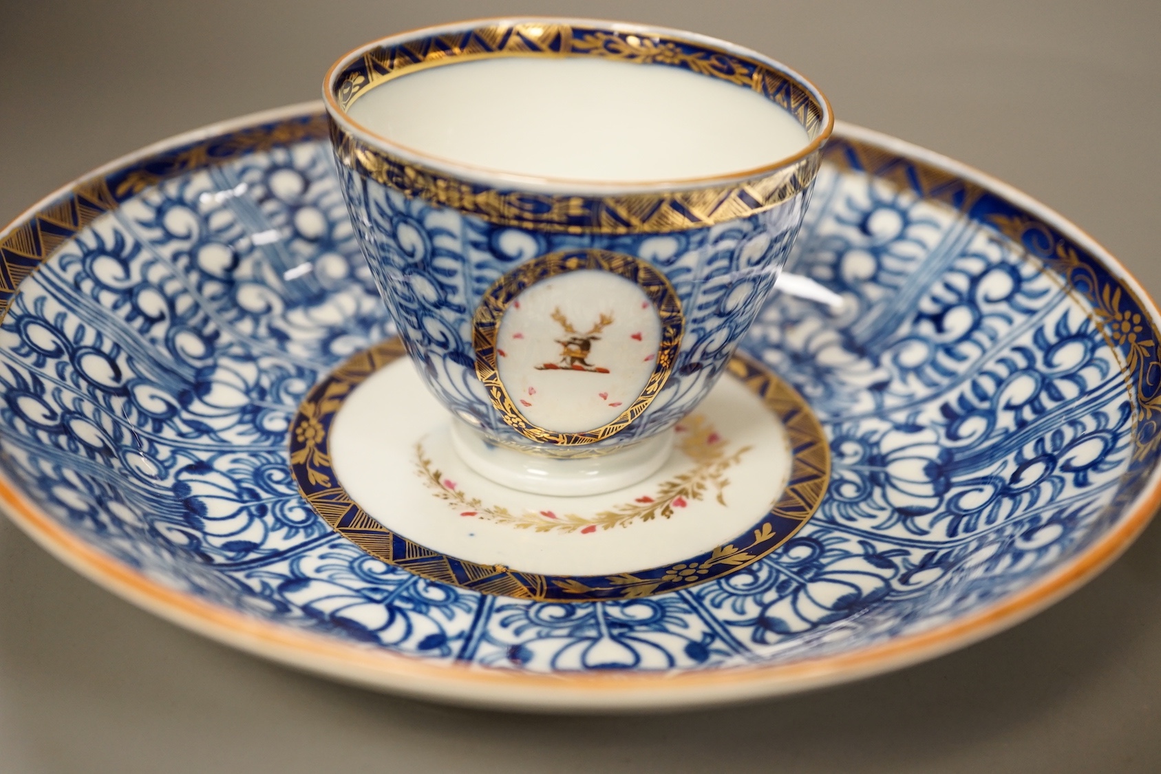 Chamberlains Worcester Armorial teawares, coffee cup, teacup and saucer and a saucer shaped dish, centres with the crest of a stag
